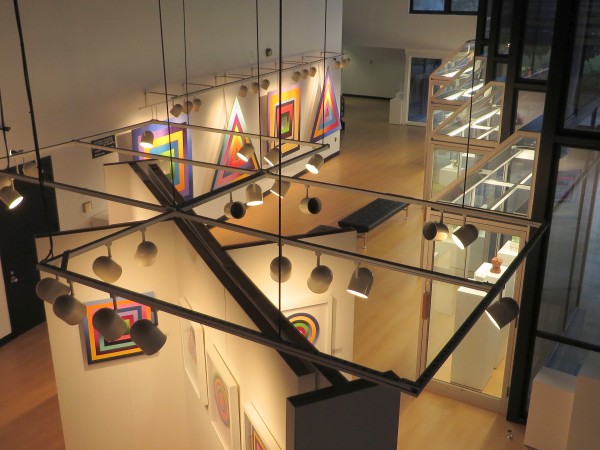 View from overwalk showing 4 display cubes, south display wall, and glass cases